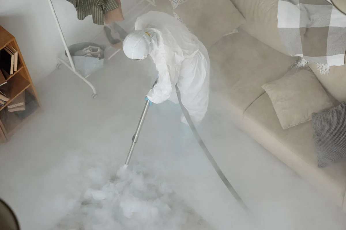 Biohazard cleanup technician in protective equipment, Tennessee Ridge, TN
